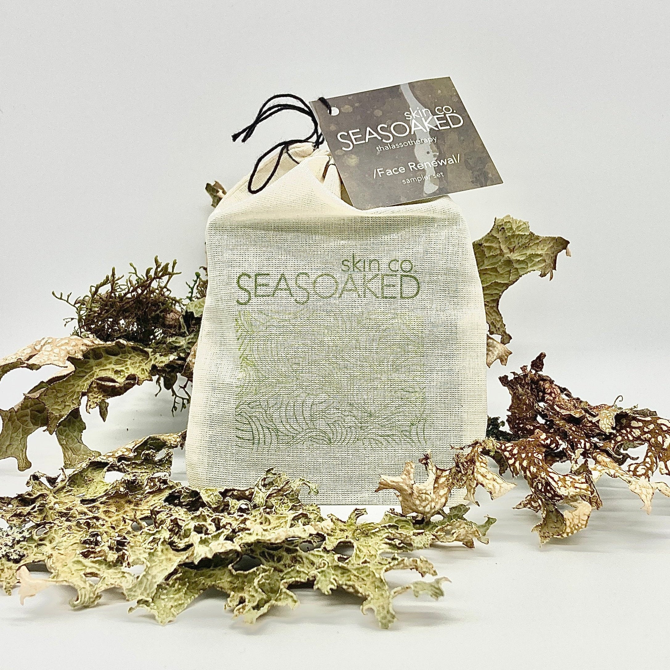 Face Renewal Sampler Set surrounded by dried seaweed.