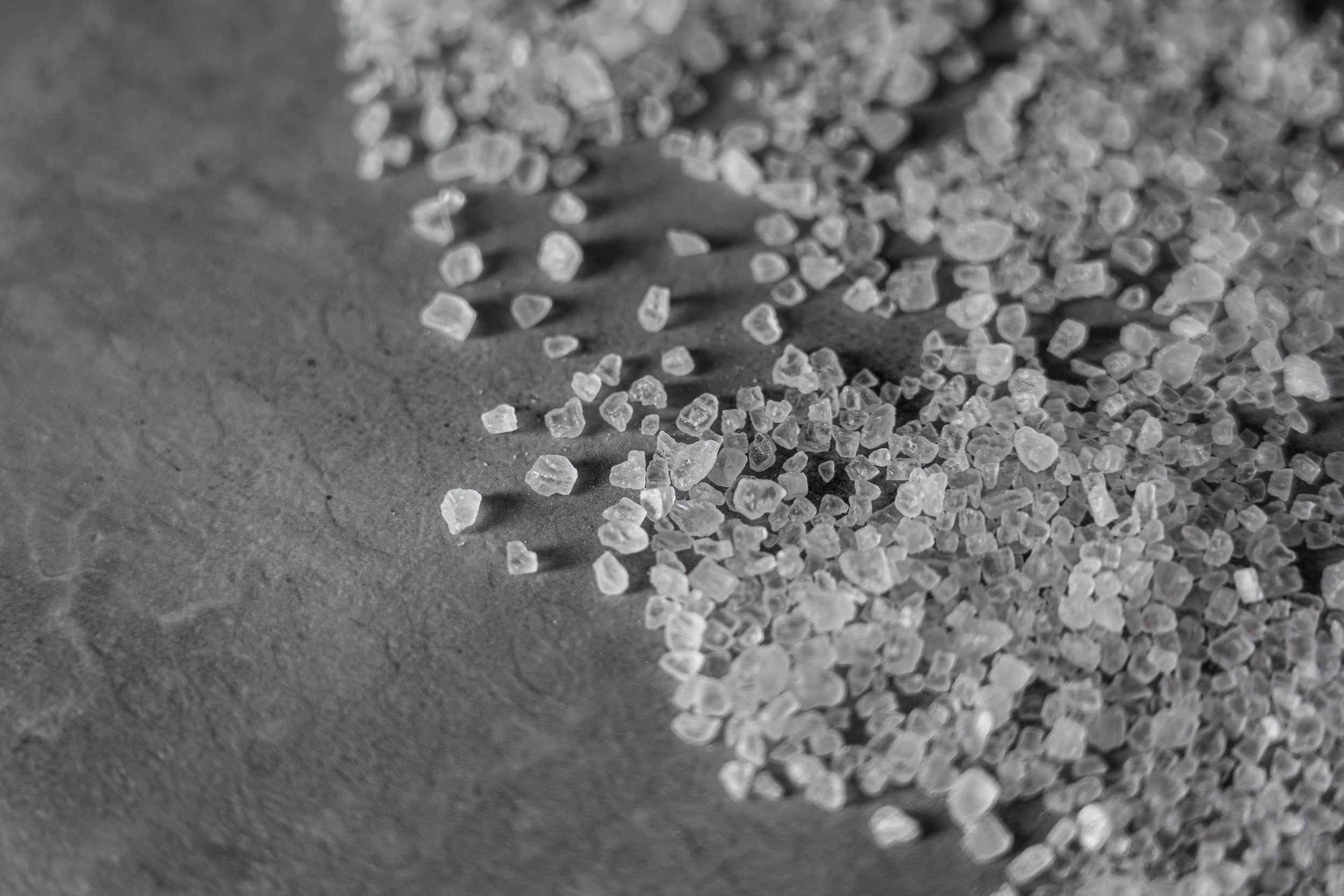 Close up black and white photo of salt crystals.