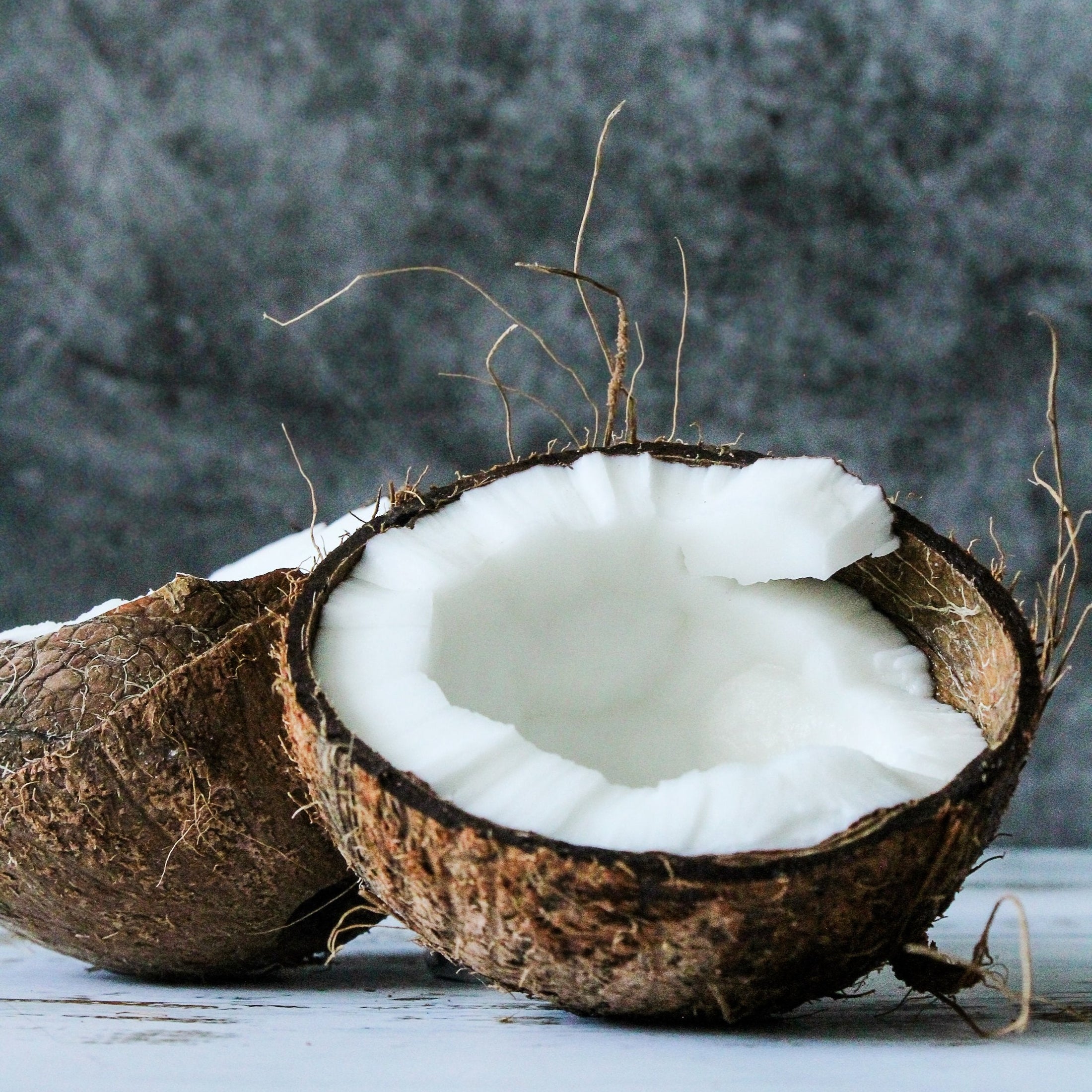 A coconut that has been cut in half.