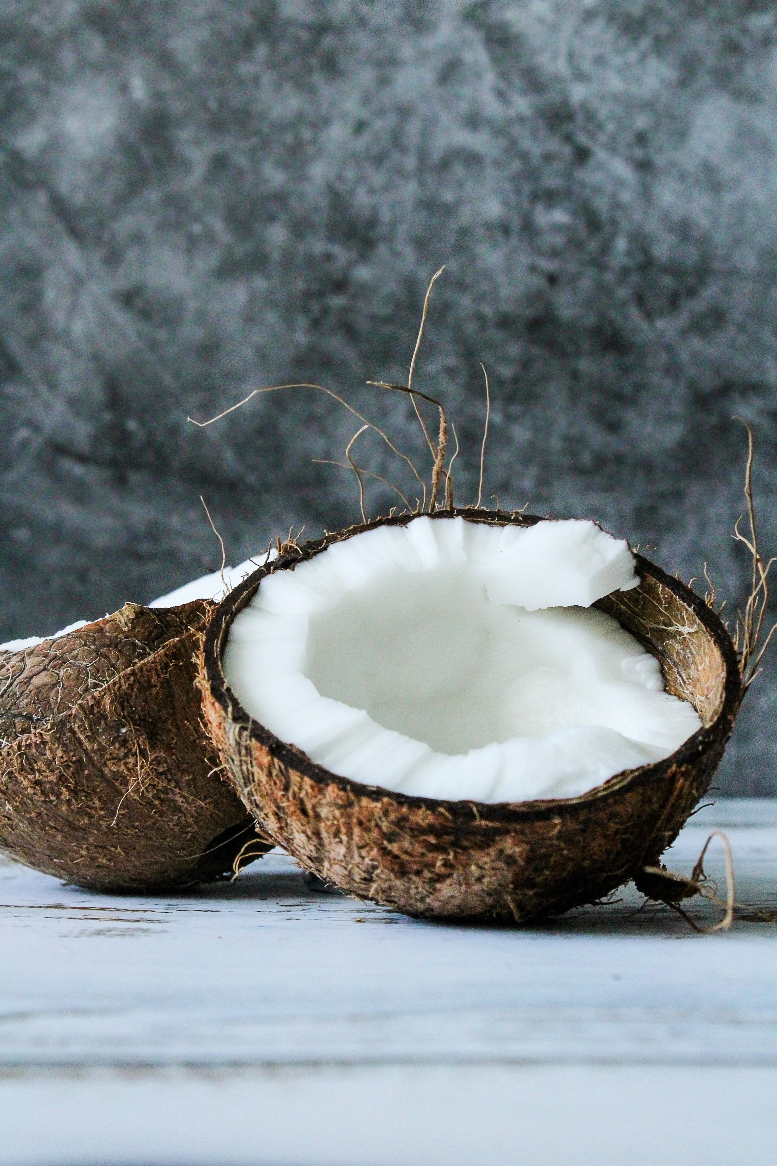 A coconut that has been cut in half.